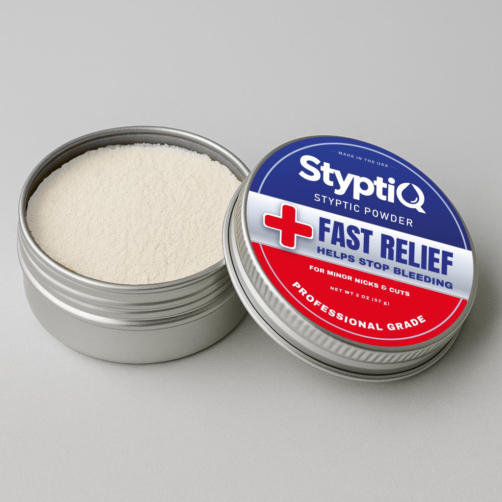 Open StyptiQ tin showing fine white potassium alum styptic powder